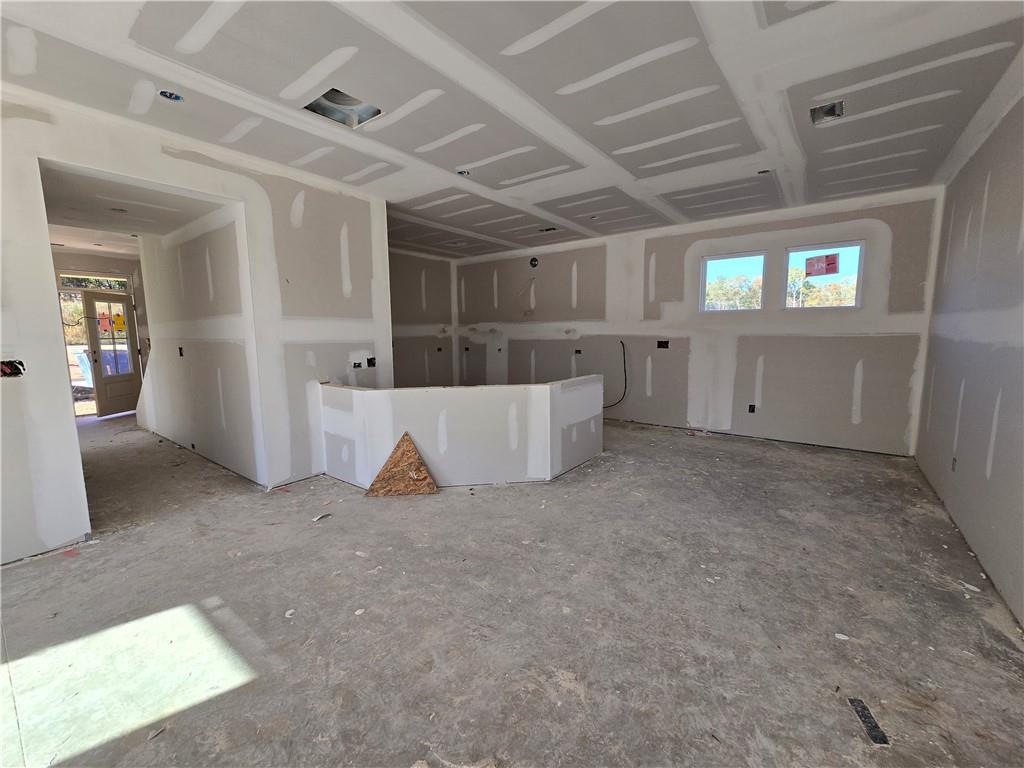 154 Marble Tree Way Ball Ground, GA 30107 - Photo 5 of 9 a view of a room with gym equipment