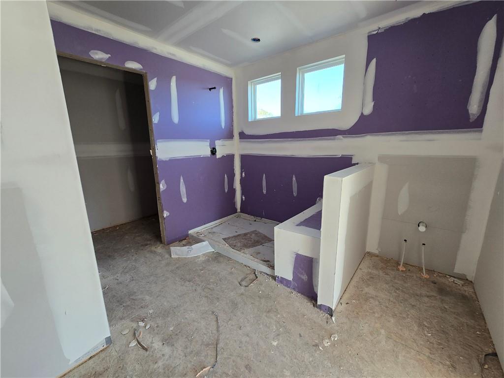 154 Marble Tree Way Ball Ground, GA 30107 - Photo 7 of 9 a view of a kitchen with furniture and staircase