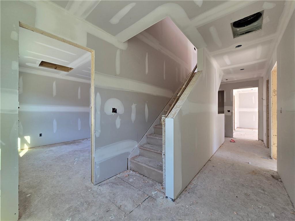 154 Marble Tree Way Ball Ground, GA 30107 - Photo 8 of 9 a view of a hallway with staircase