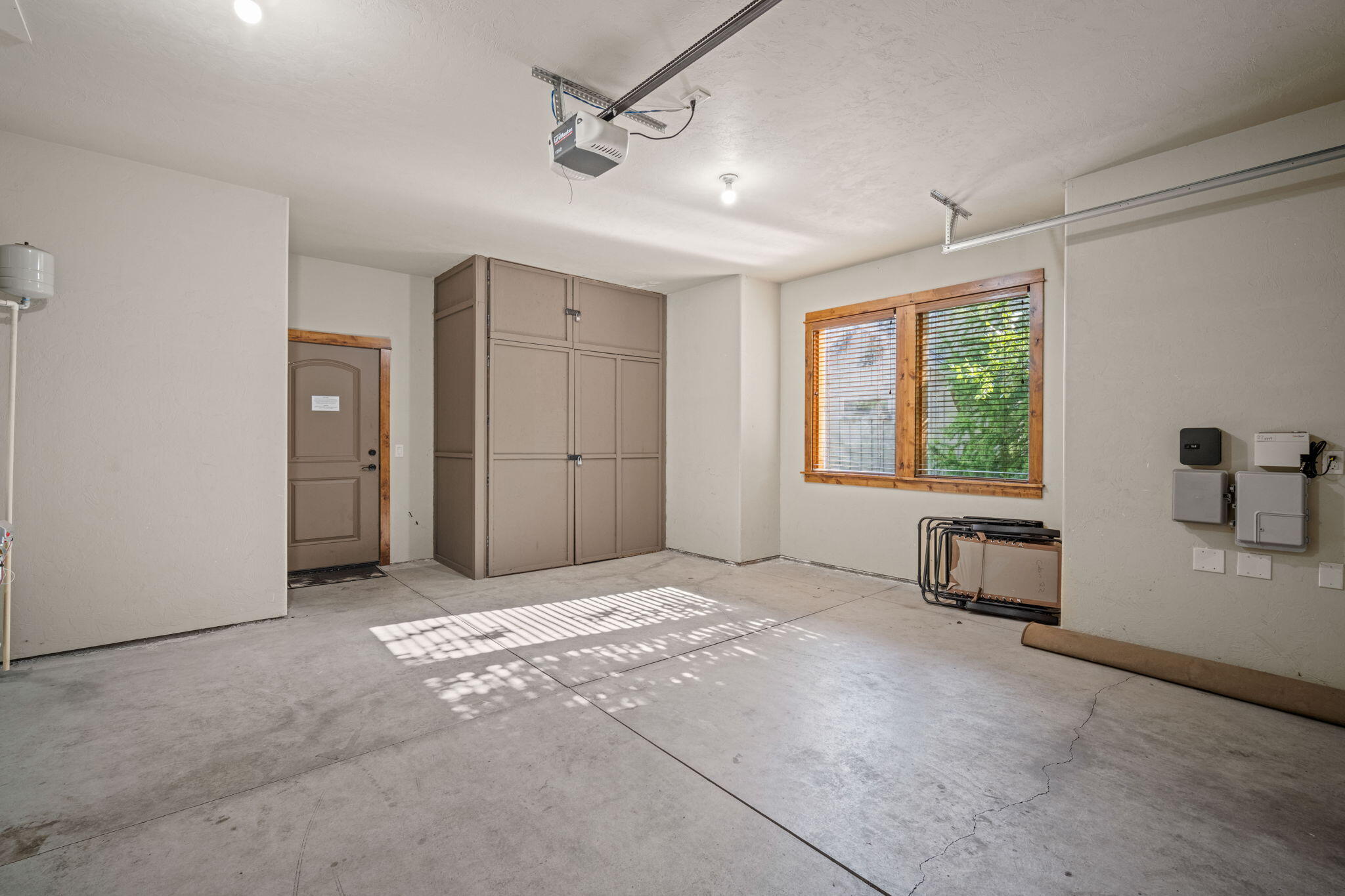 56508 Dancing Rock Loop, Unit 22 Bend, OR 97707 - Photo 52 of 69 a view of empty room with windows and wardrobe