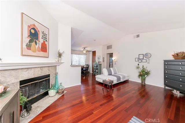 a view of a dining room with furniture and a kitchen