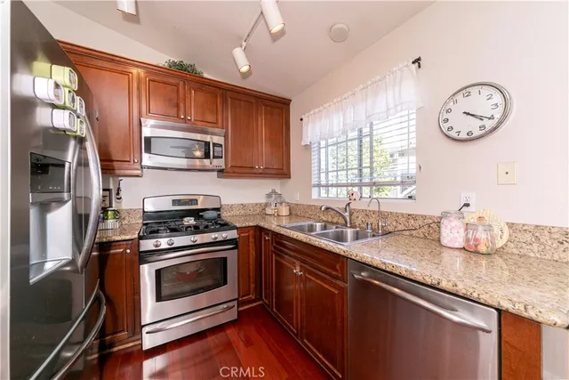 a view of a kitchen with a table and chairs