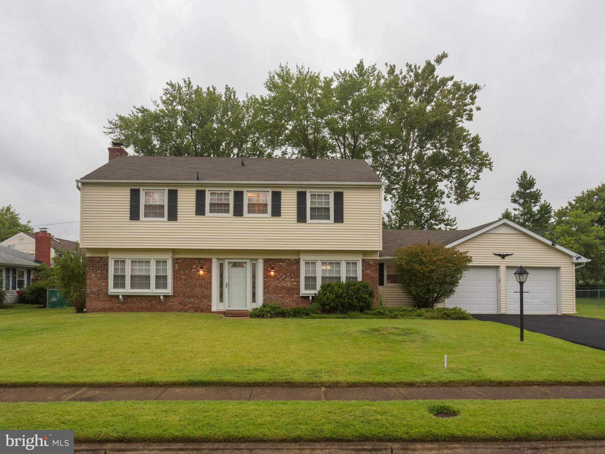 13132 Moss Ranch Lane Fairfax, VA 22033 - Photo 1 of 30 a front view of a house with a yard