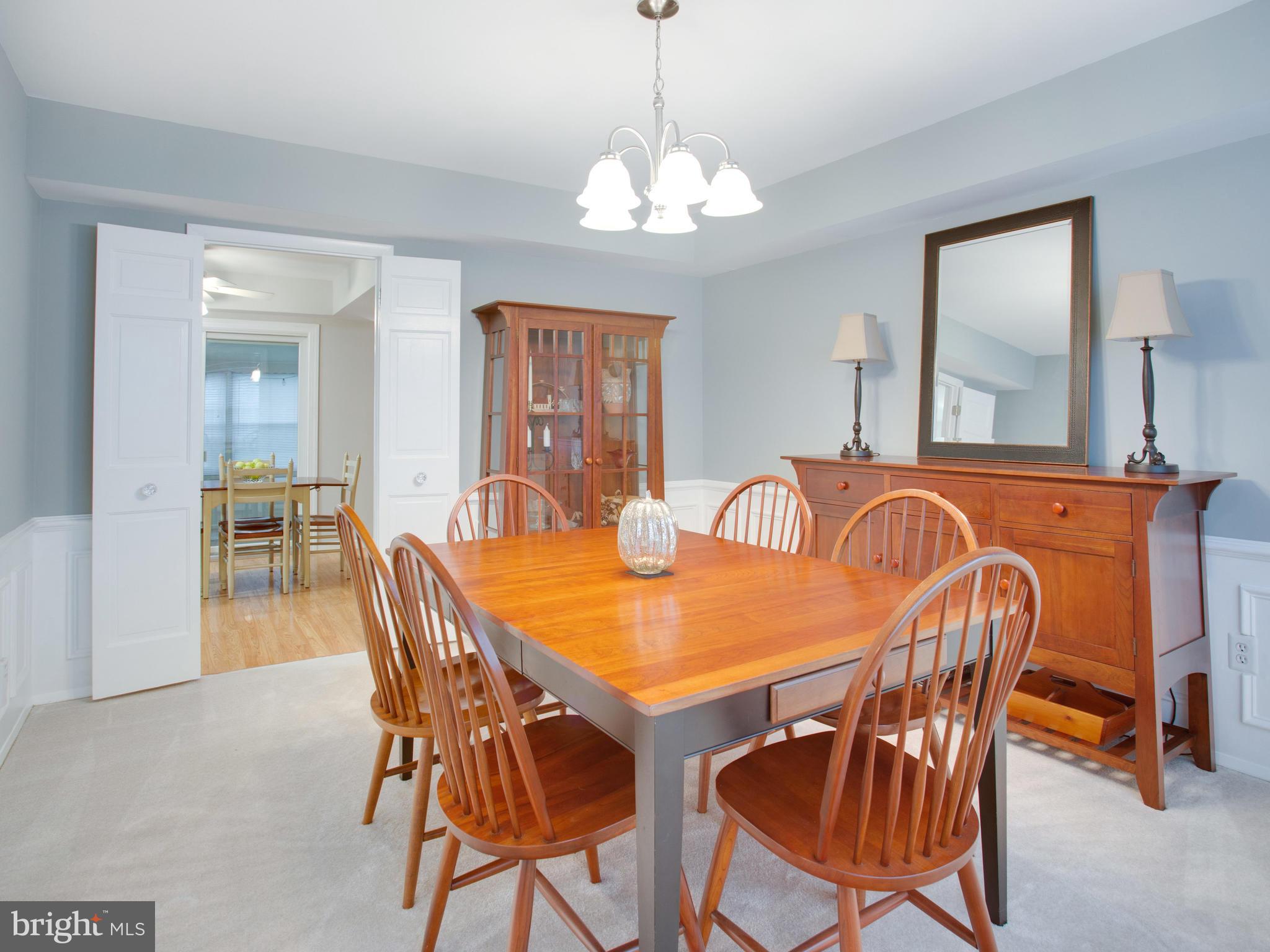 13132 Moss Ranch Lane Fairfax, VA 22033 - Photo 15 of 30 a view of a a dining room with furniture window and wooden floor