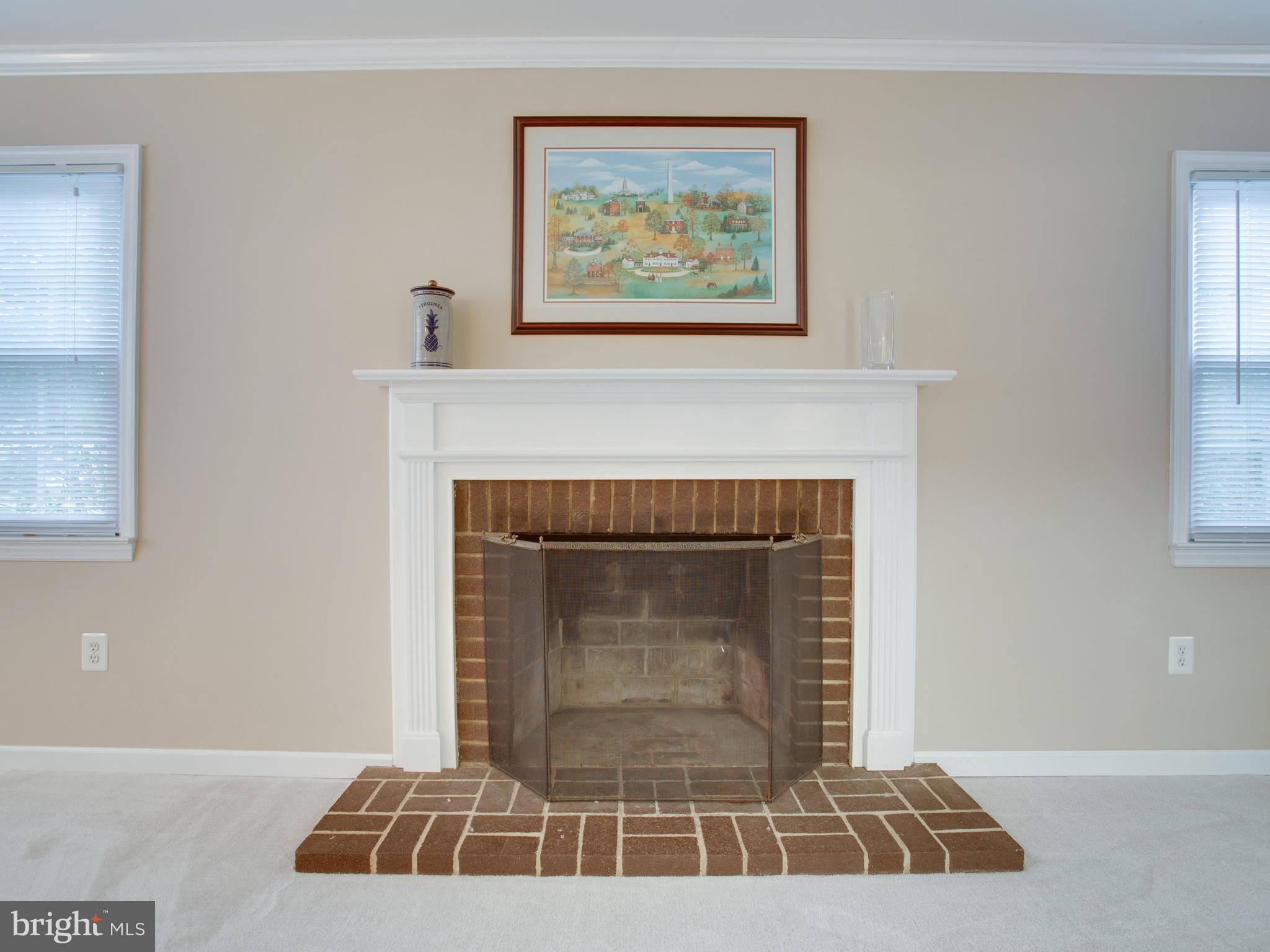 13132 Moss Ranch Lane Fairfax, VA 22033 - Photo 17 of 30 a living room with furniture and a fireplace