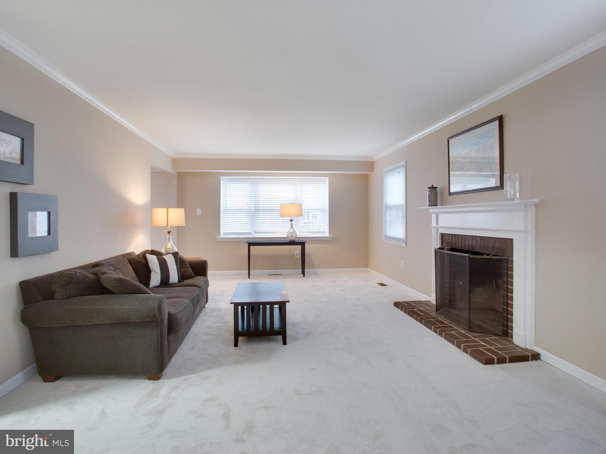 13132 Moss Ranch Lane Fairfax, VA 22033 - Photo 18 of 30 a living room with furniture and a fireplace