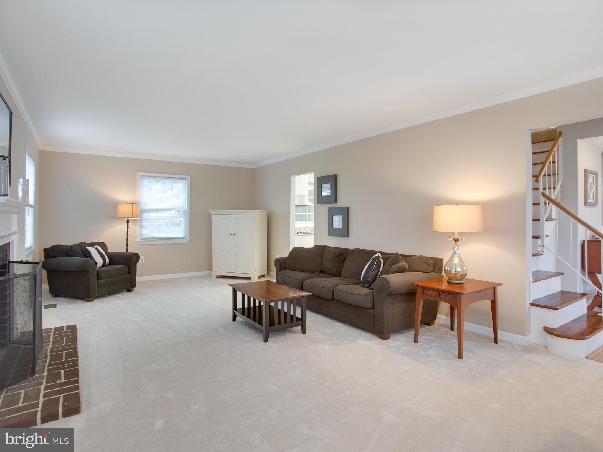 13132 Moss Ranch Lane Fairfax, VA 22033 - Photo 19 of 30 a living room with furniture and a lamp