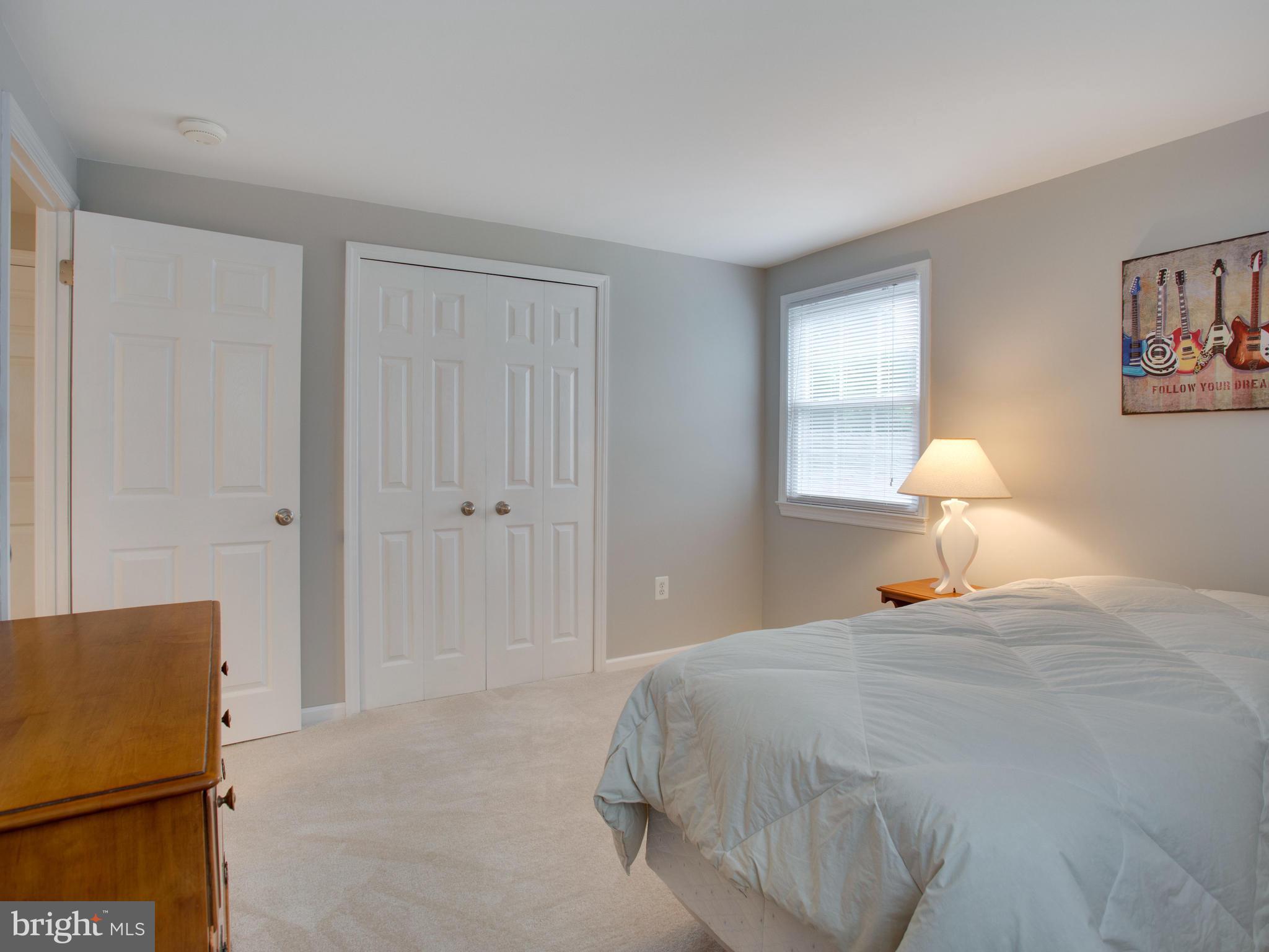 13132 Moss Ranch Lane Fairfax, VA 22033 - Photo 21 of 30 a bedroom with a bed and a window