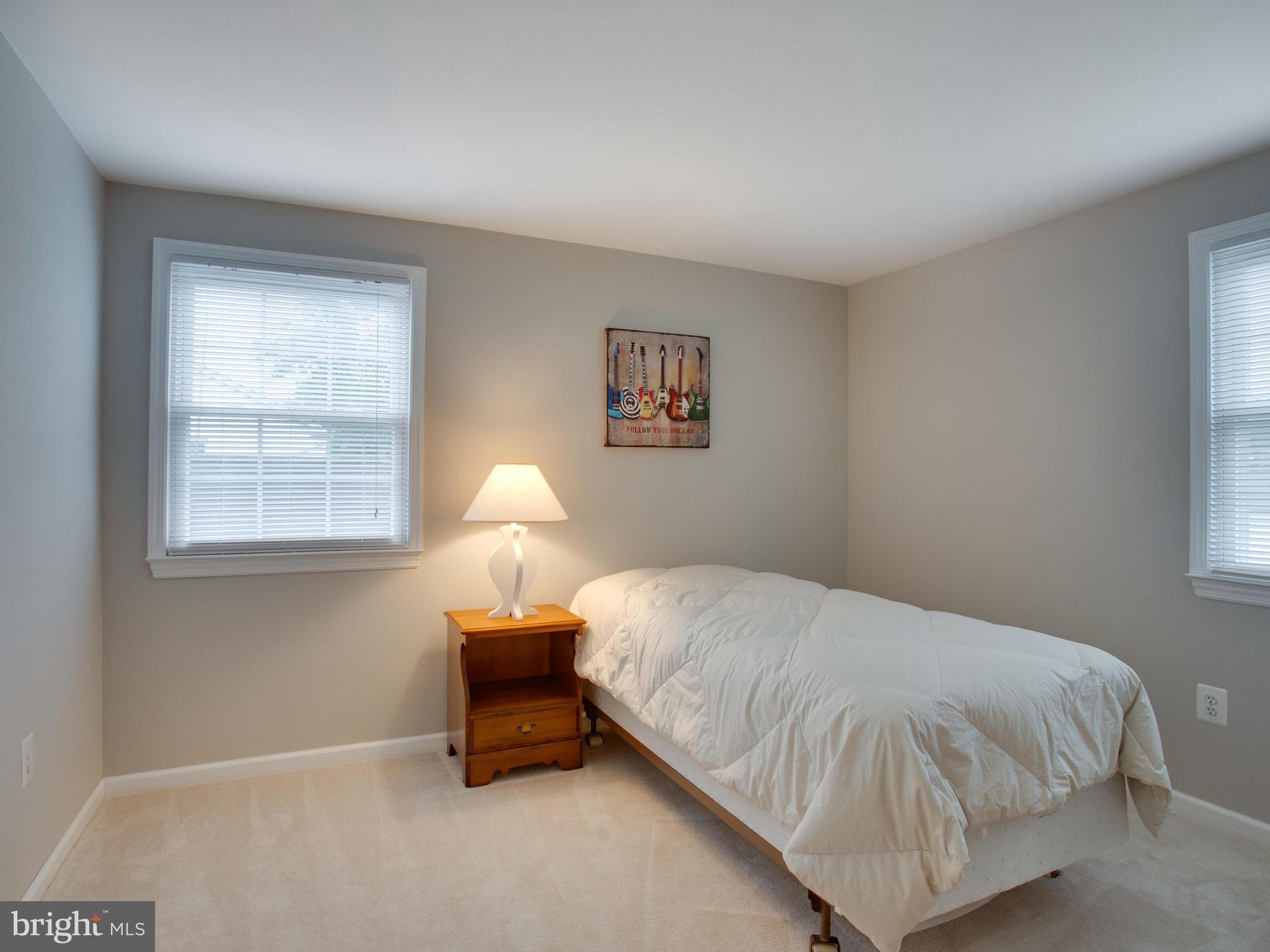 13132 Moss Ranch Lane Fairfax, VA 22033 - Photo 22 of 30 a bedroom with a bed and window