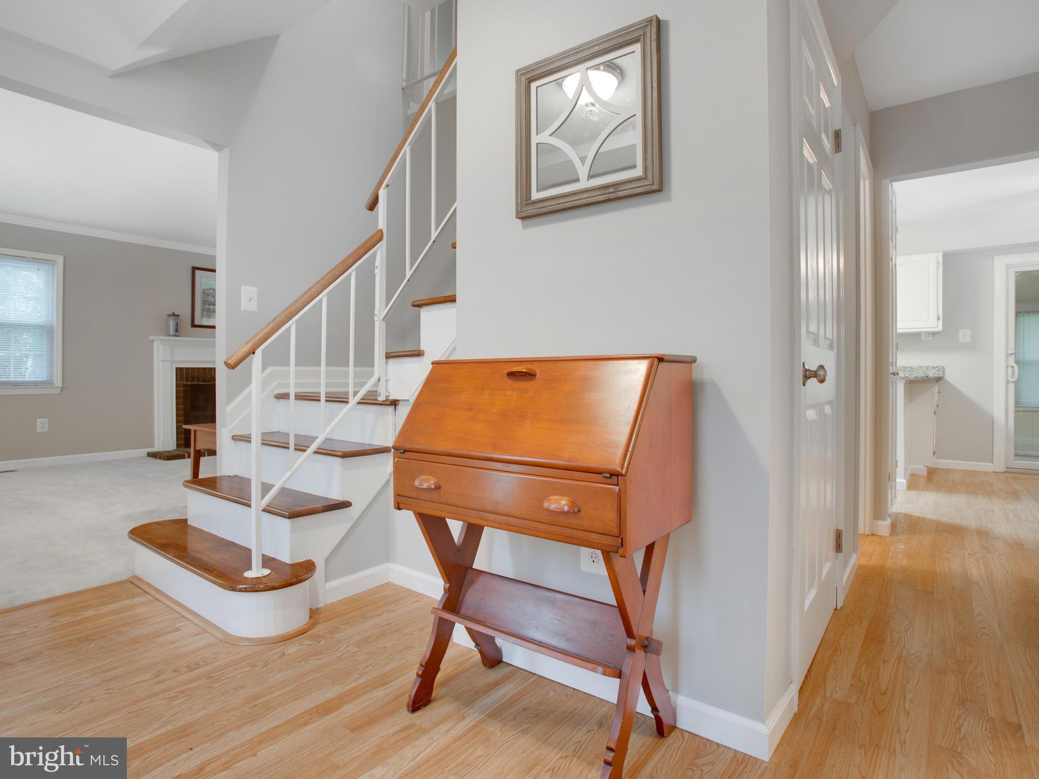 13132 Moss Ranch Lane Fairfax, VA 22033 - Photo 7 of 30 a room with wooden floor and windows