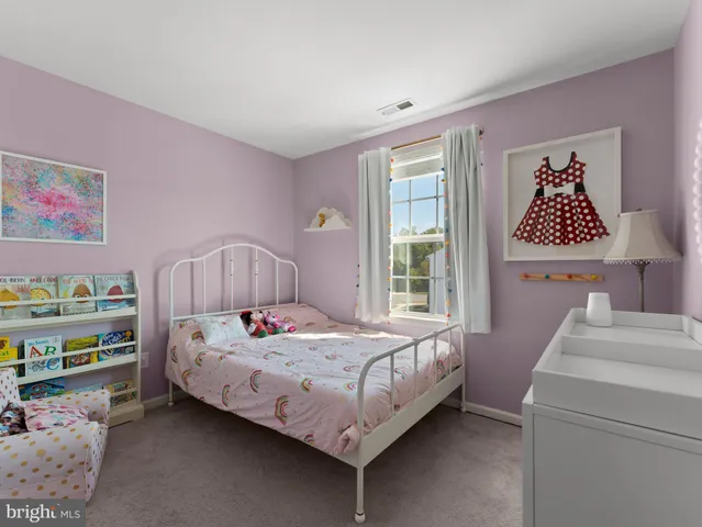 a bedroom with a bed and a table in it