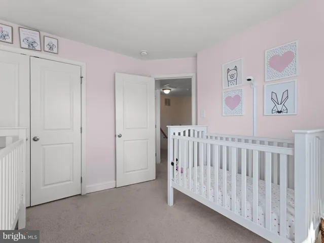 a view of a hallway with entryway door