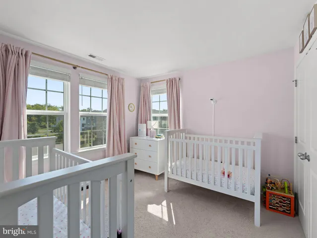a bathroom with a double vanity sink mirror and bathtub