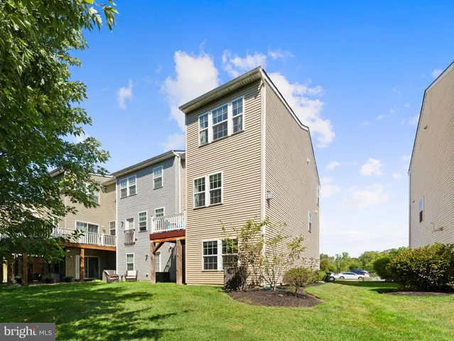 a front view of a building with garden
