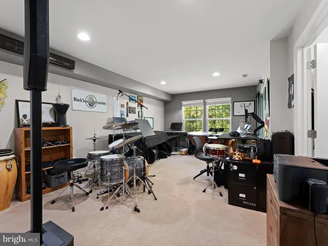 a living room with lots of furniture and gym equipment