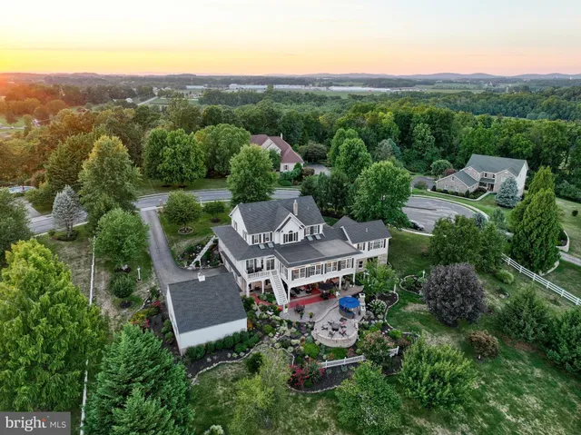 a kitchen with stainless steel appliances granite countertop a stove and white cabinets