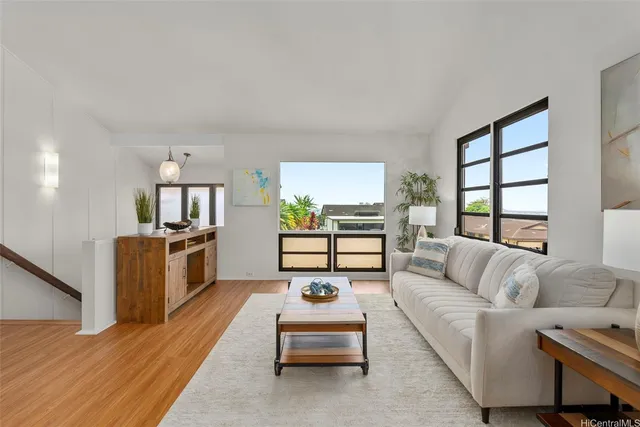 a living room with furniture and a table