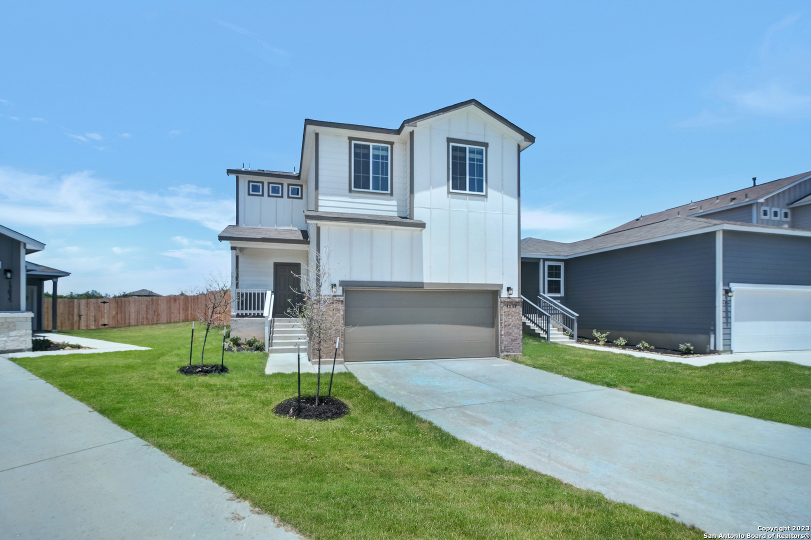 4038 Fallow Crossing St. Hedwig, TX 78152 - Photo 1 of 1 a front view of a house with a yard and garage