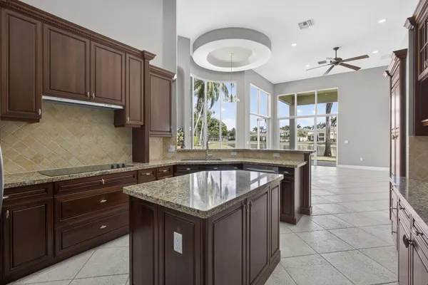 a kitchen with a stove a sink and a refrigerator