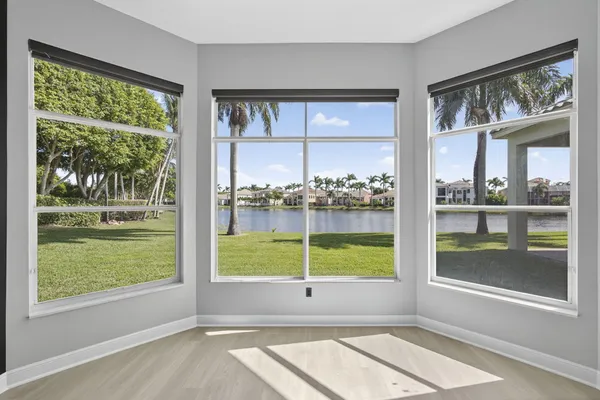 a view of a room that has a window and a yard
