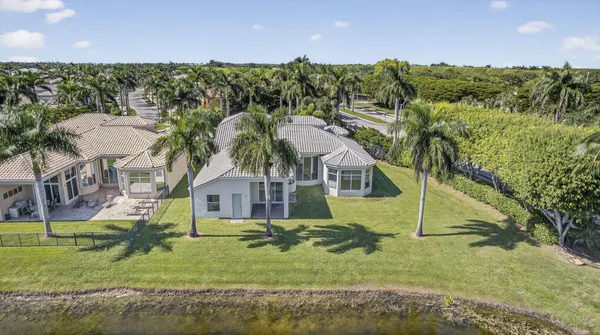 an aerial view of a house with a yard