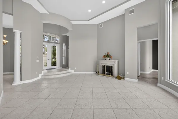 a view of a livingroom with a fireplace and cabinet