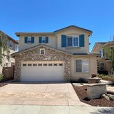 a view of house with outdoor space and sitting space