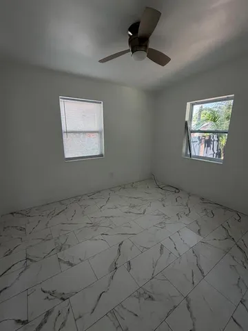 a bathroom with a toilet a sink and bathtub