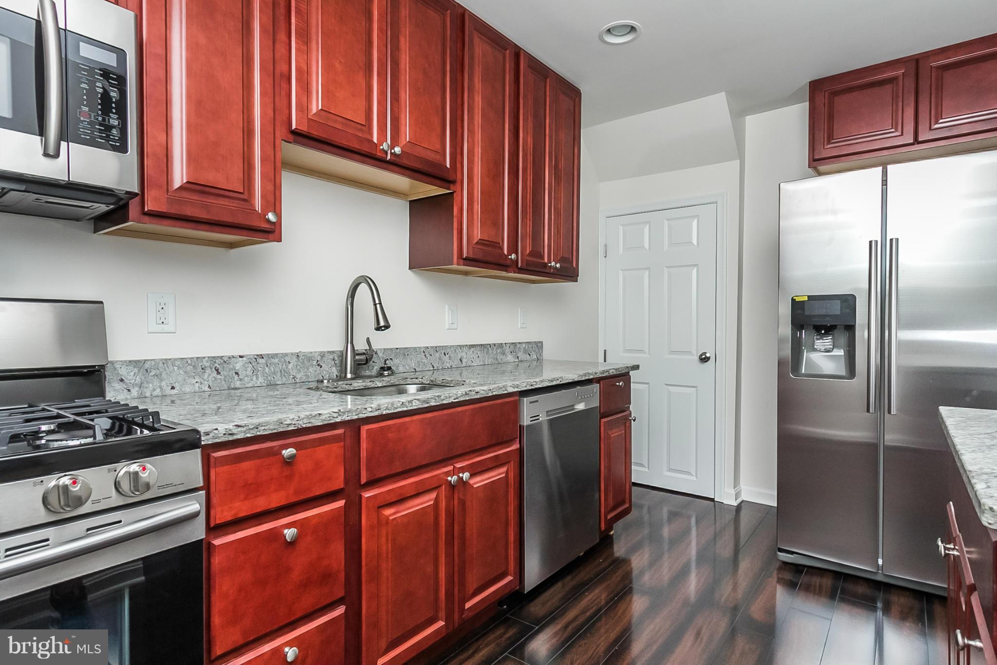 16 Bladen Road Baltimore, MD 21221 - Photo 1 of 29 a kitchen with stainless steel appliances granite countertop a refrigerator stove and sink
