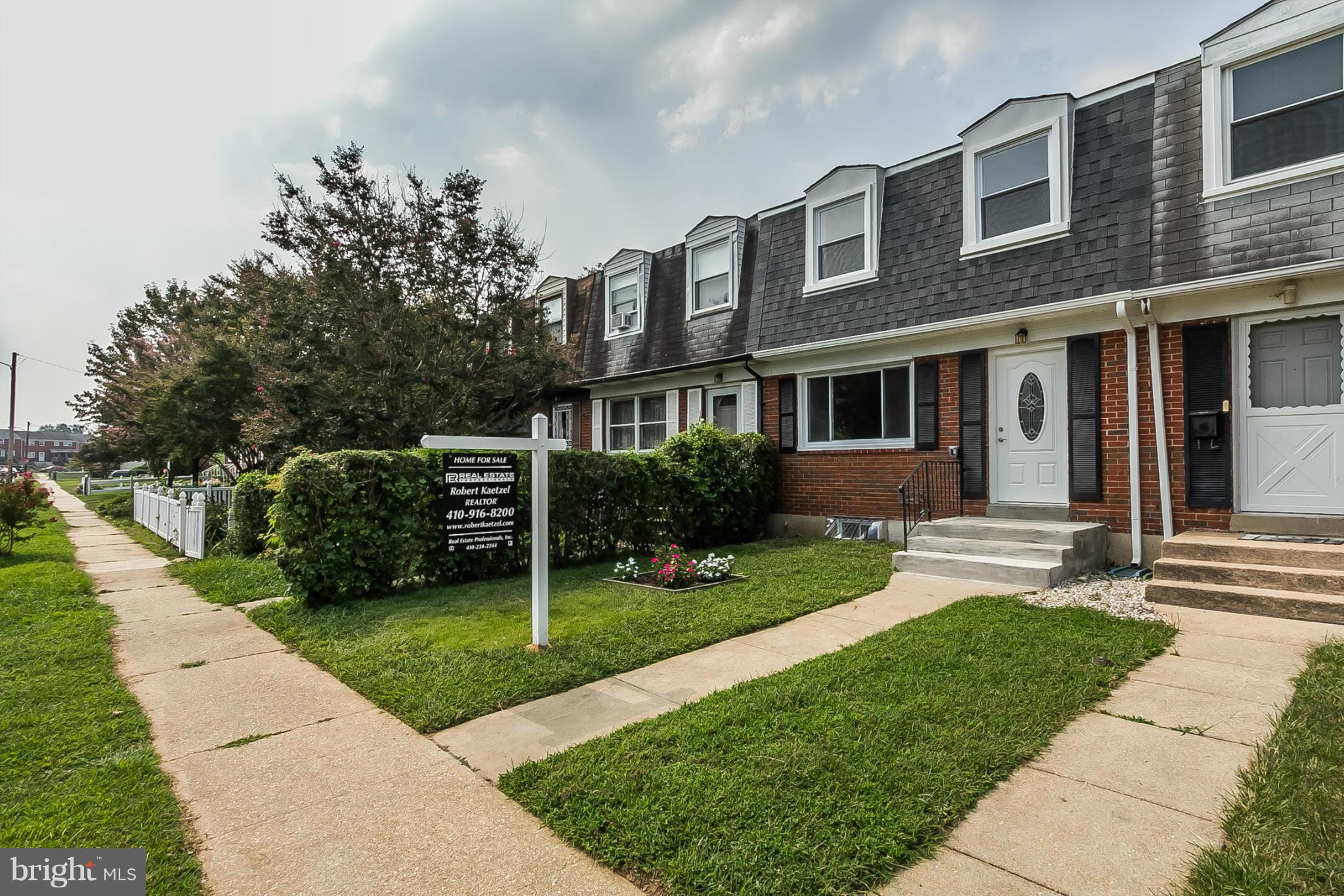 16 Bladen Road Baltimore, MD 21221 - Photo 2 of 29 a front view of a house with a yard and potted plants
