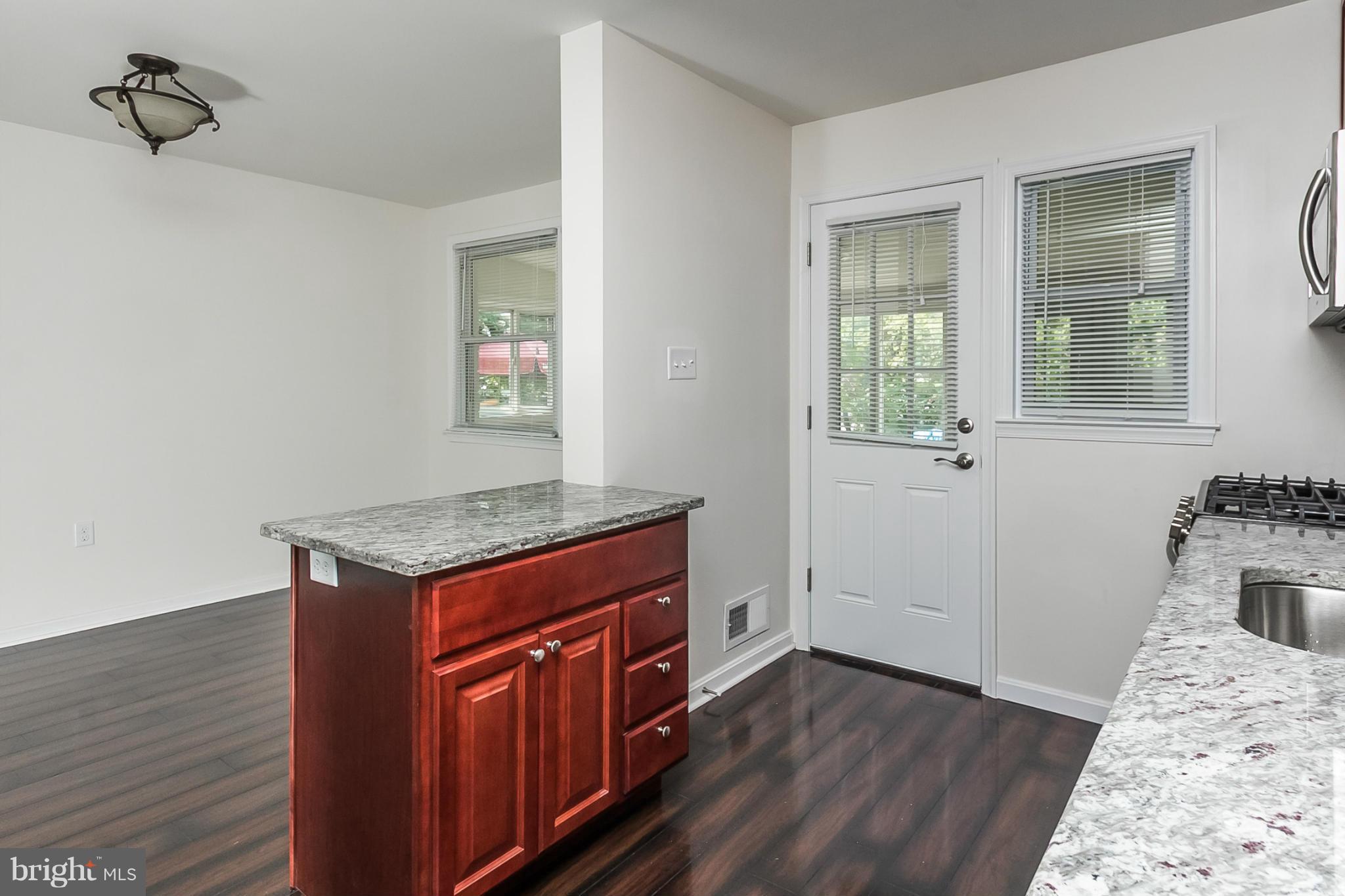 16 Bladen Road Baltimore, MD 21221 - Photo 12 of 29 a view of a kitchen from the hallway