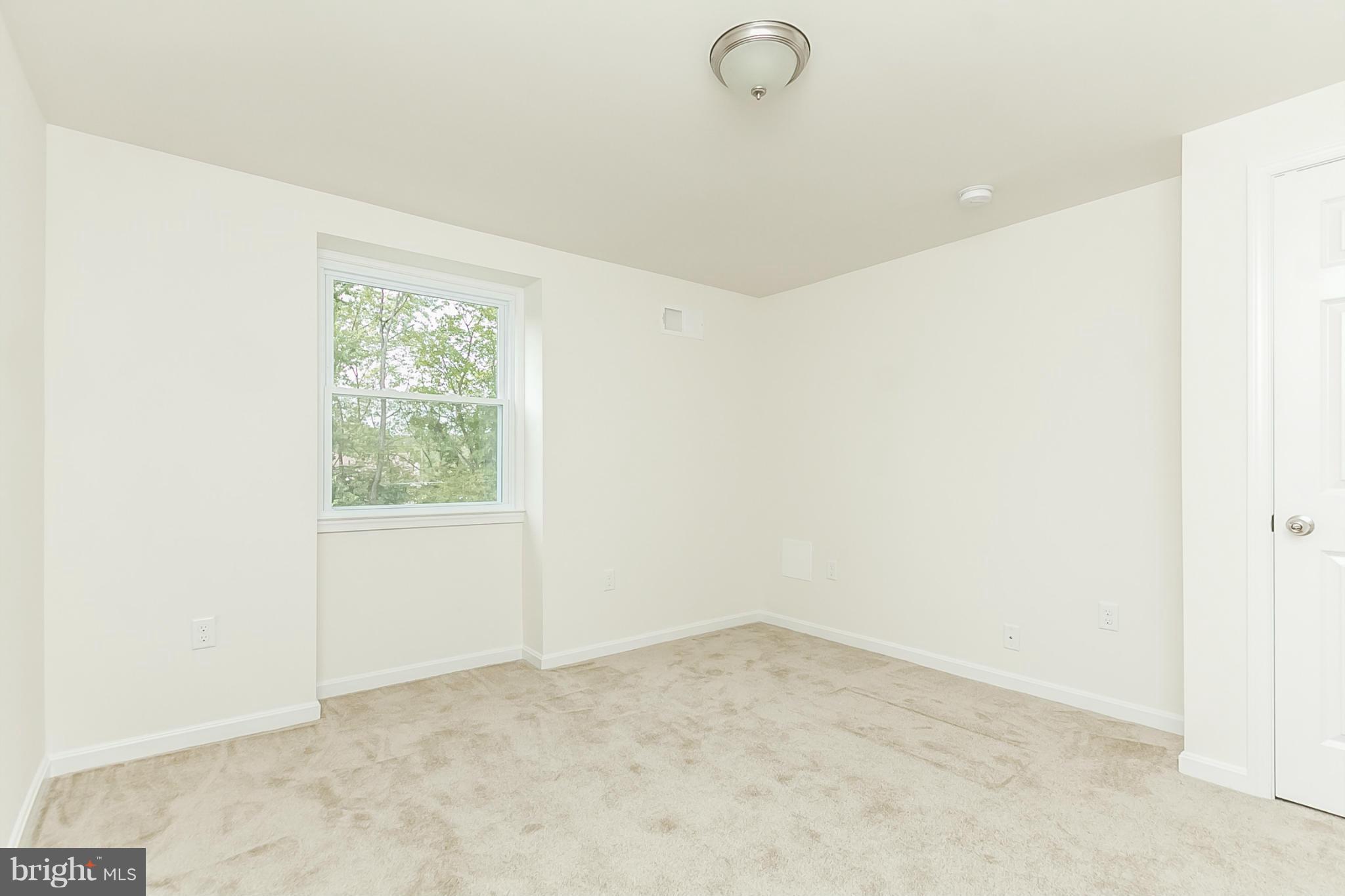 16 Bladen Road Baltimore, MD 21221 - Photo 19 of 29 an empty room with a empty space and a window
