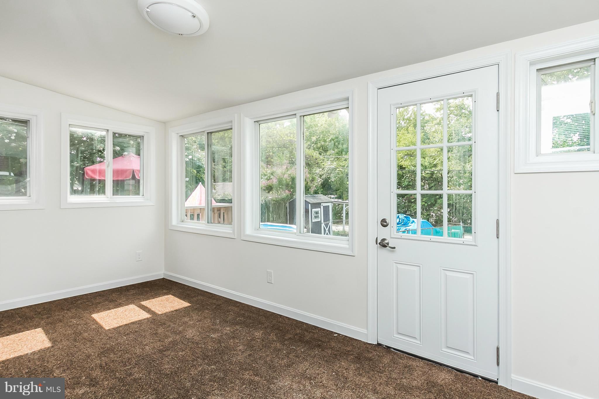 16 Bladen Road Baltimore, MD 21221 - Photo 21 of 29 a view of empty room with wooden floor and fan
