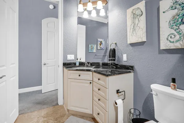 a bedroom with a bed and cabinets