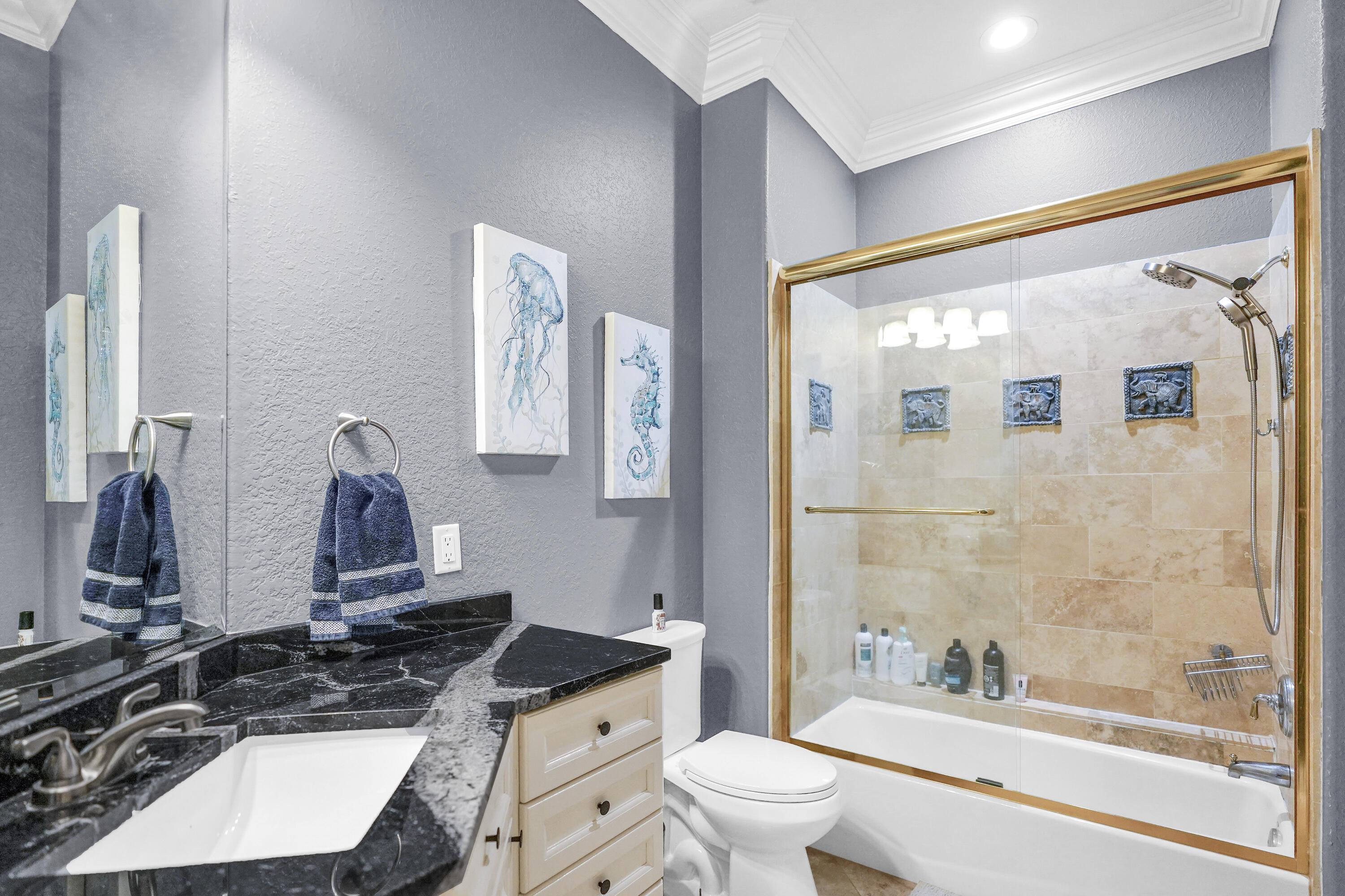 602 Harbor Boulevard, Unit 301 Destin, FL 32541 - Photo 12 of 75 a bathroom with a double vanity sink toilet mirror and shower