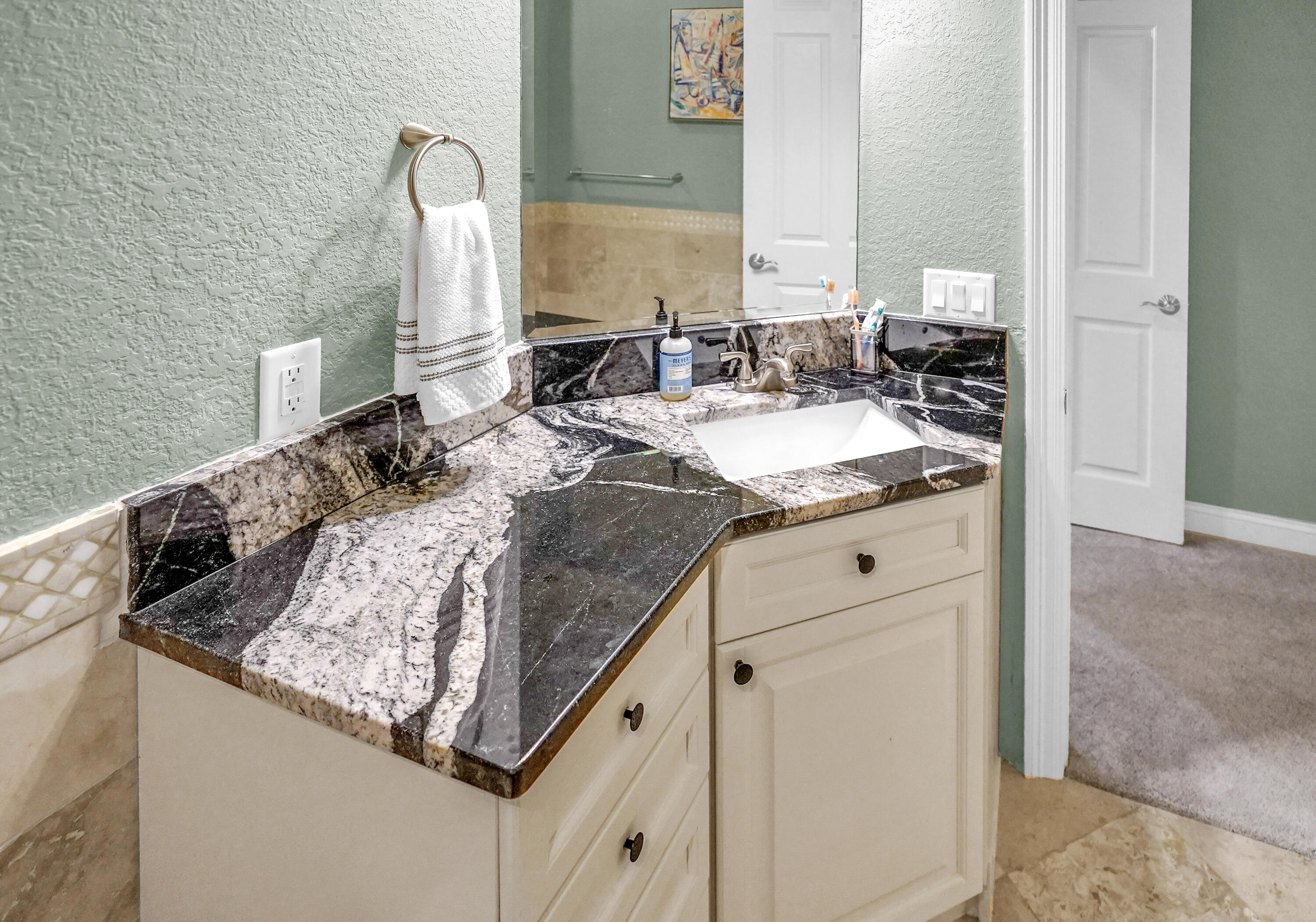 602 Harbor Boulevard, Unit 301 Destin, FL 32541 - Photo 13 of 75 a bathroom with sinks granite and a mirror