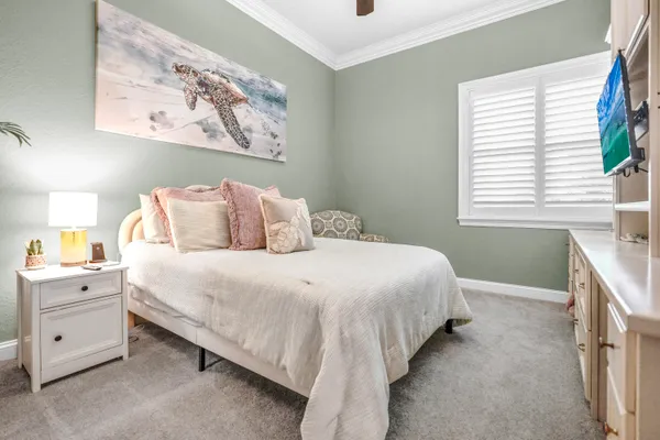 a kitchen with stainless steel appliances granite countertop a stove a sink a refrigerator dining table and chairs