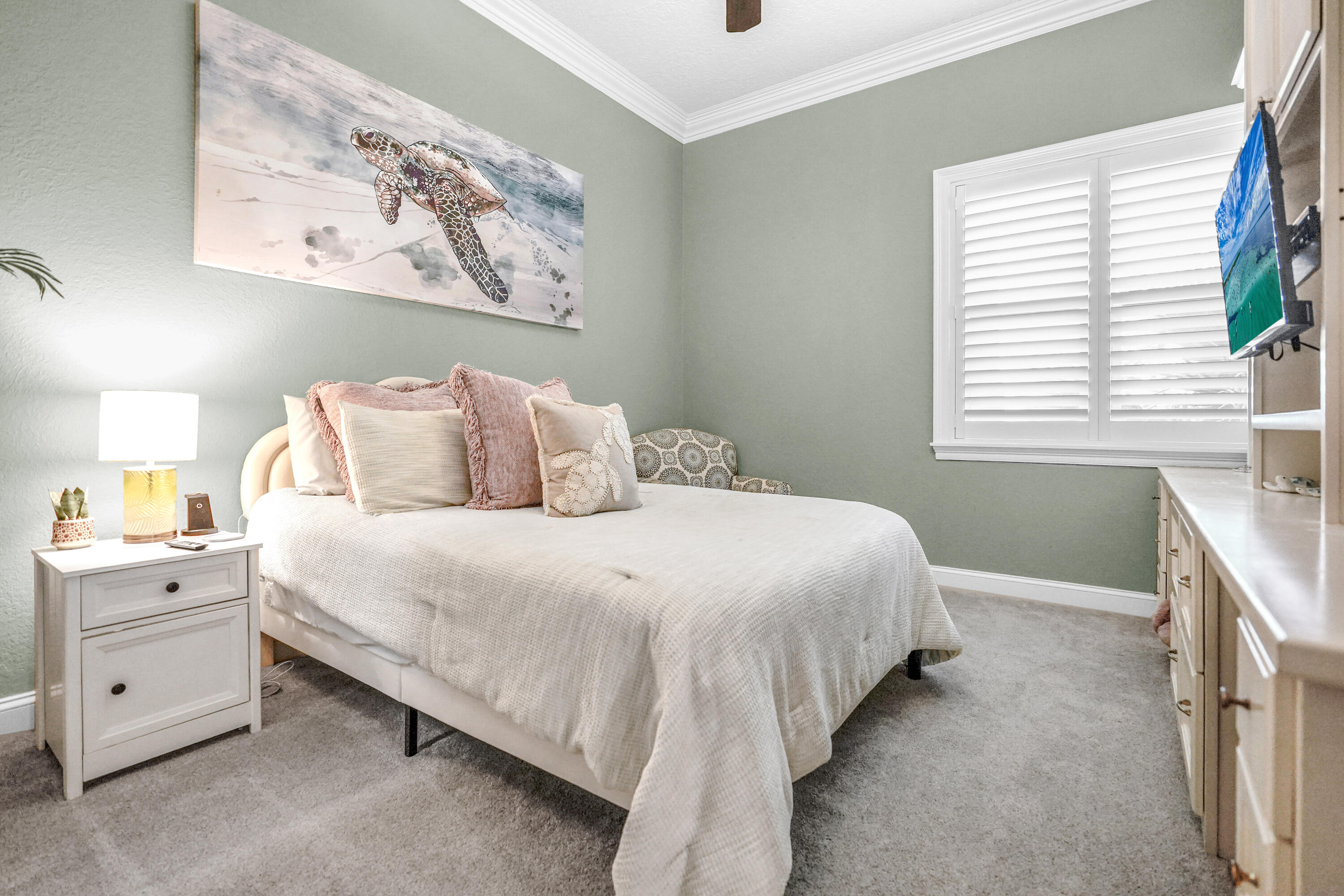 602 Harbor Boulevard, Unit 301 Destin, FL 32541 - Photo 15 of 75 a bedroom with a bed and a window