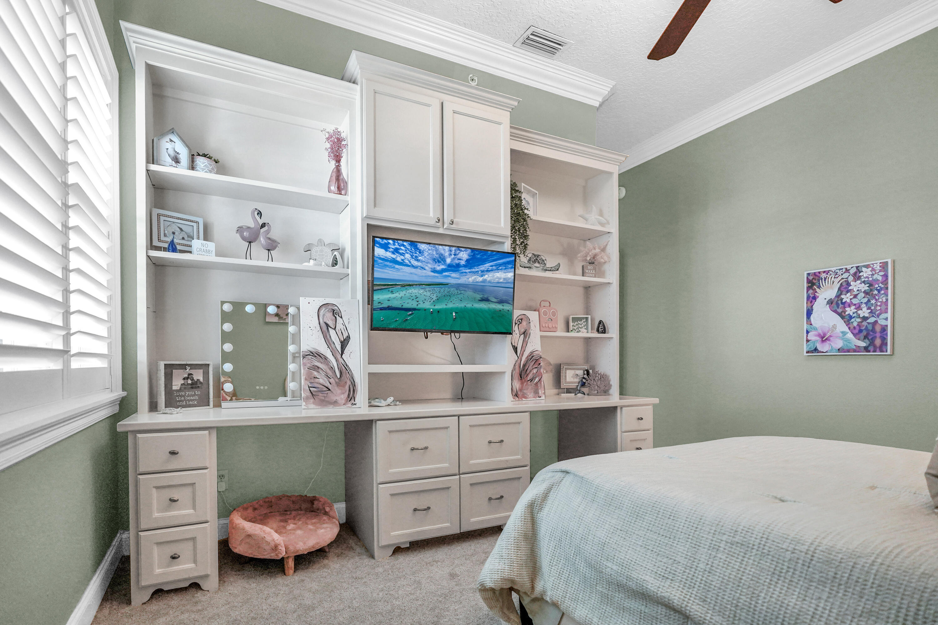 602 Harbor Boulevard, Unit 301 Destin, FL 32541 - Photo 17 of 75 a bedroom with a bed and cabinets