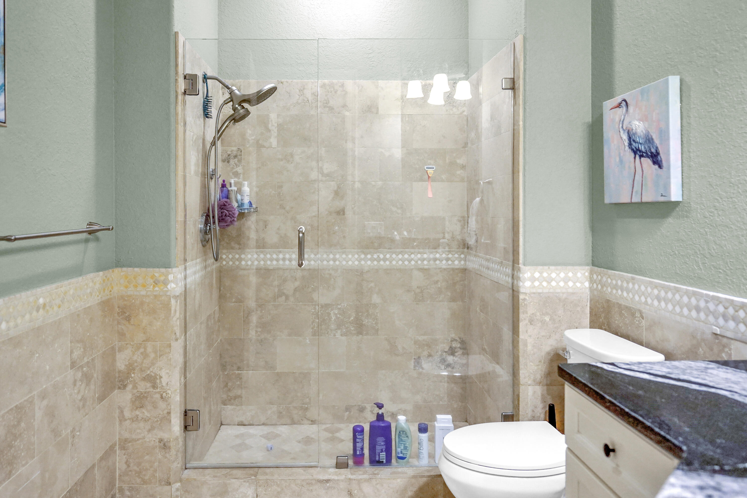 602 Harbor Boulevard, Unit 301 Destin, FL 32541 - Photo 18 of 75 a bathroom with a toilet and a shower