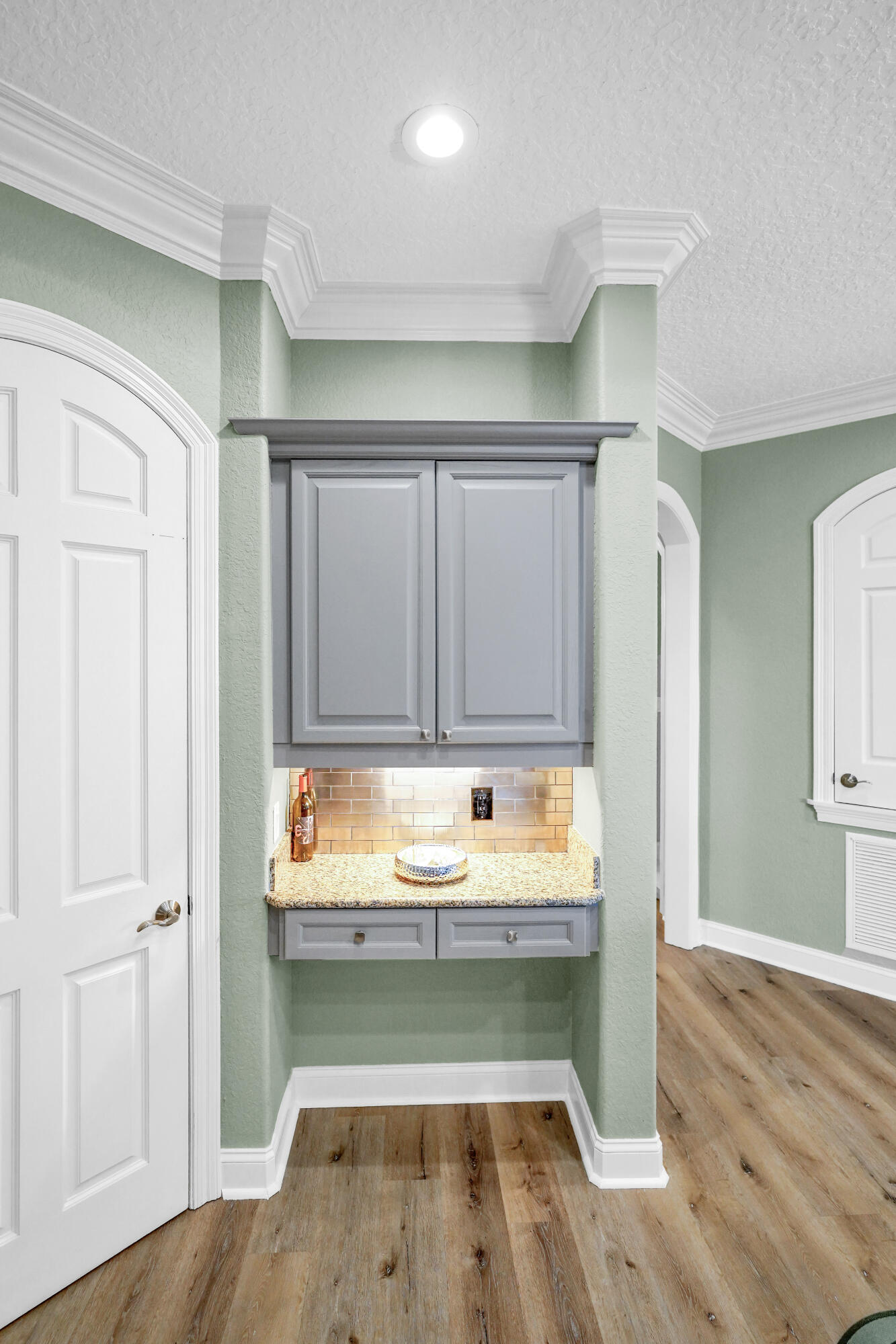 602 Harbor Boulevard, Unit 301 Destin, FL 32541 - Photo 22 of 75 a room with wooden floor and shoes