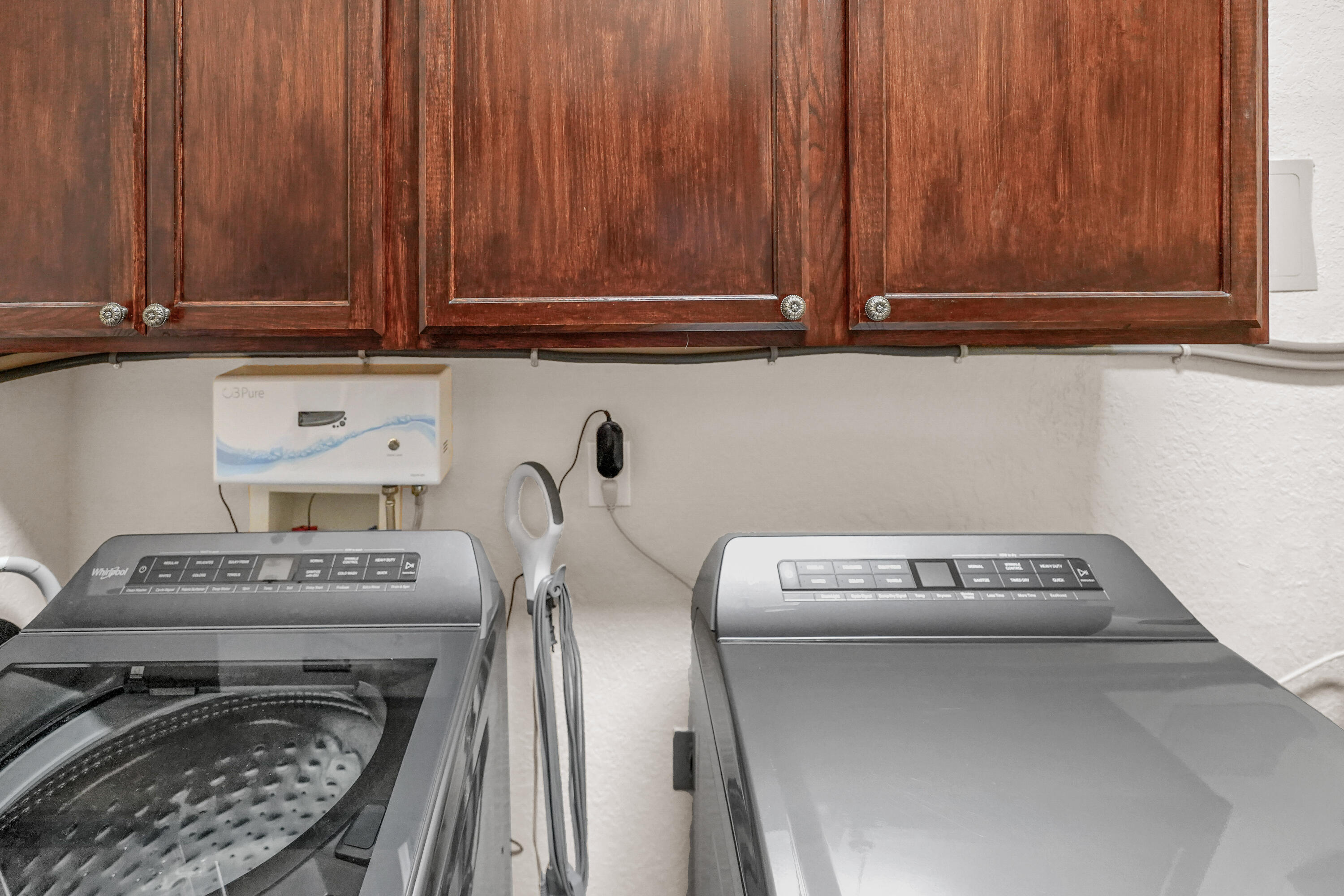 602 Harbor Boulevard, Unit 301 Destin, FL 32541 - Photo 24 of 75 a utility room with dryer and washer