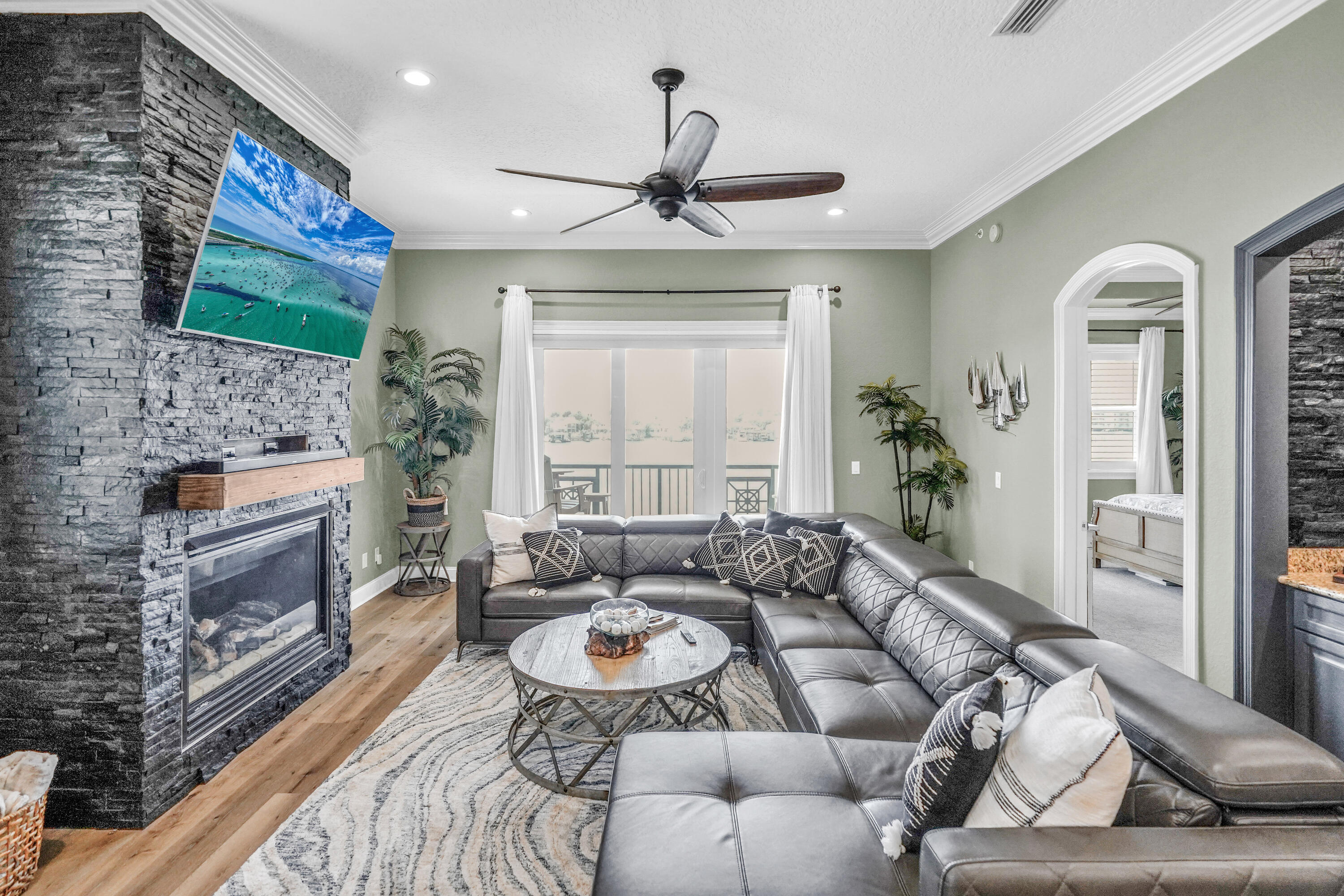 602 Harbor Boulevard, Unit 301 Destin, FL 32541 - Photo 35 of 75 a living room with furniture fireplace and flat screen tv
