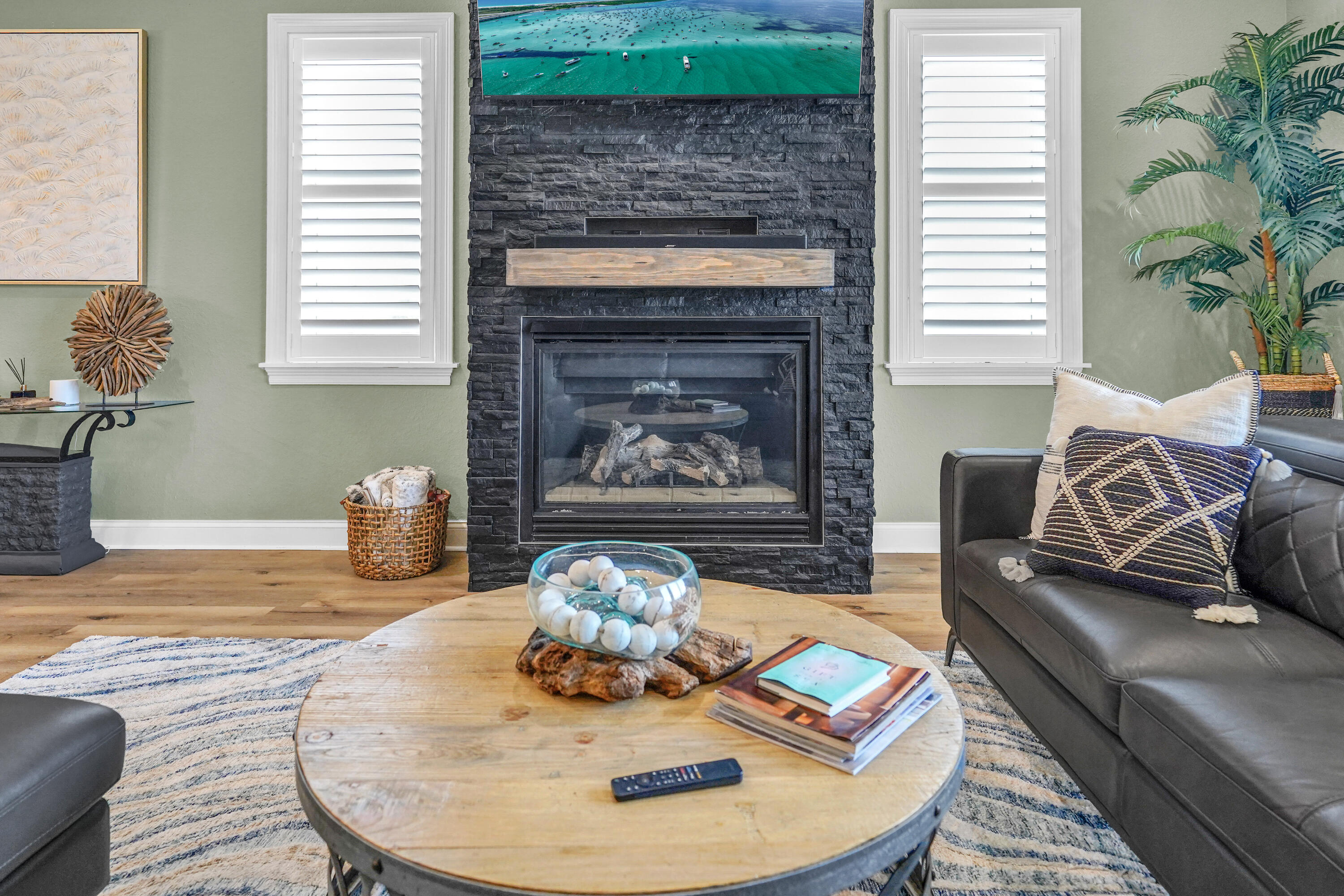 602 Harbor Boulevard, Unit 301 Destin, FL 32541 - Photo 37 of 75 a living room with furniture and a fireplace