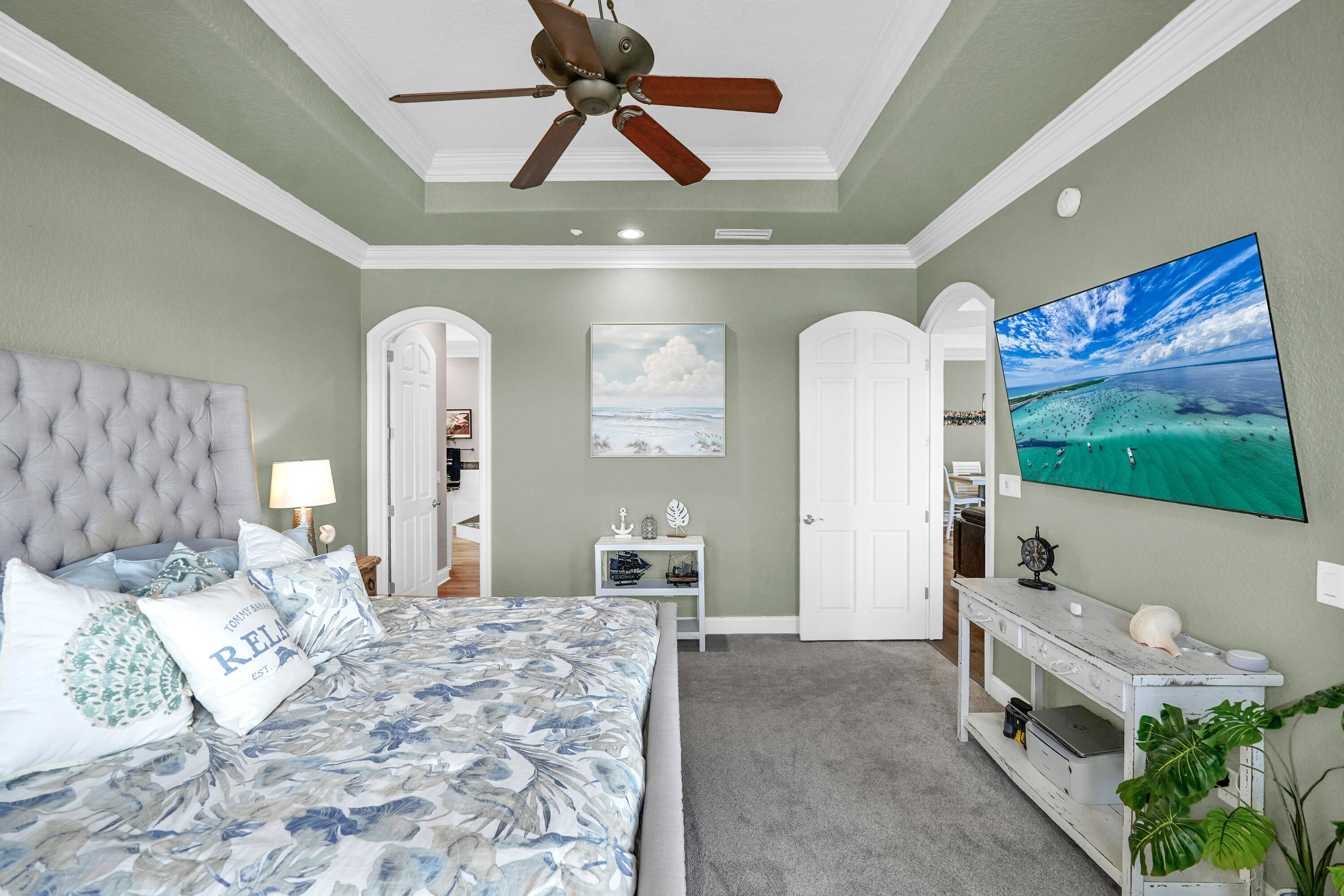 602 Harbor Boulevard, Unit 301 Destin, FL 32541 - Photo 45 of 75 a bedroom with furniture and a large mirror