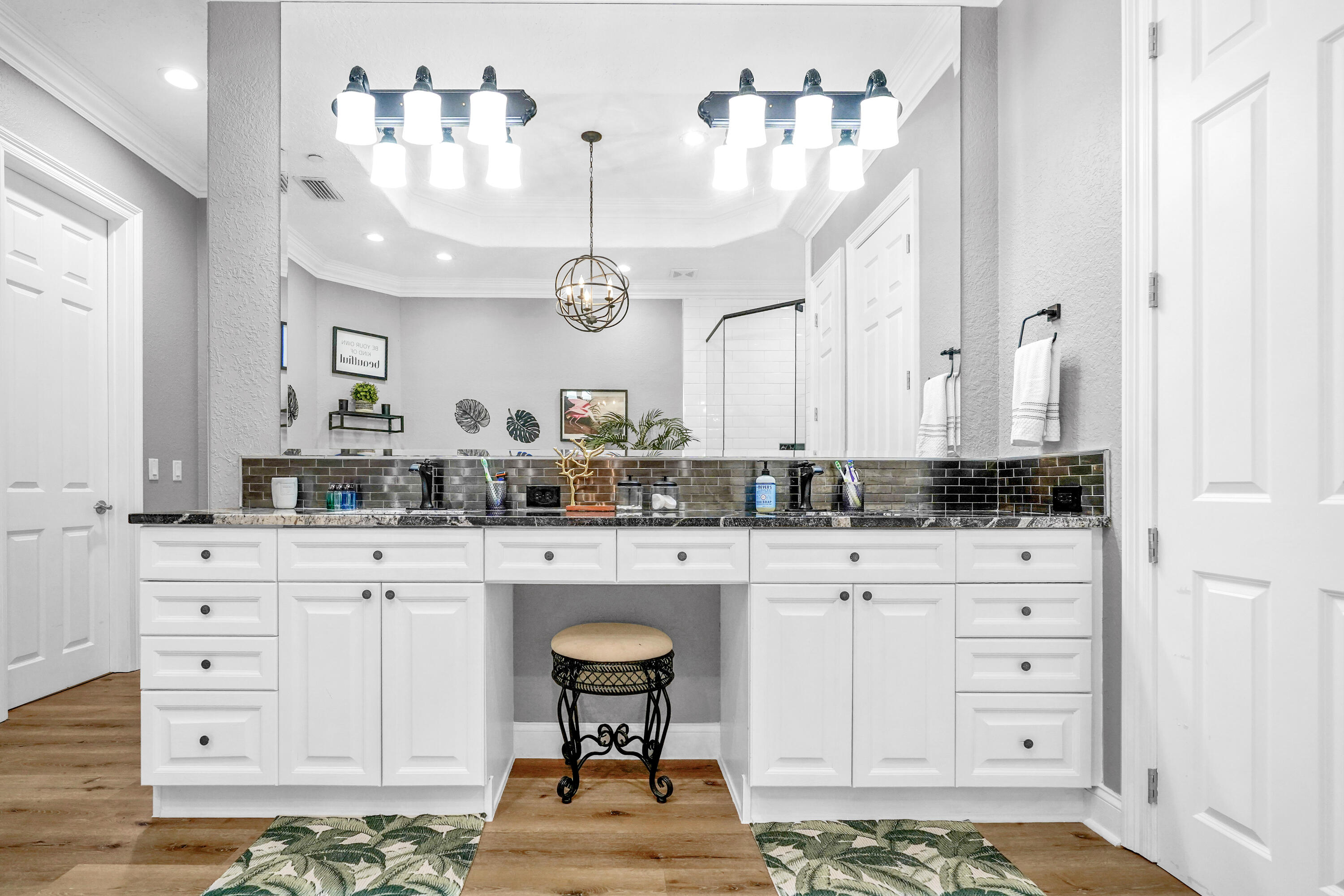602 Harbor Boulevard, Unit 301 Destin, FL 32541 - Photo 50 of 75 a spacious bathroom with a double vanity sink and a mirror