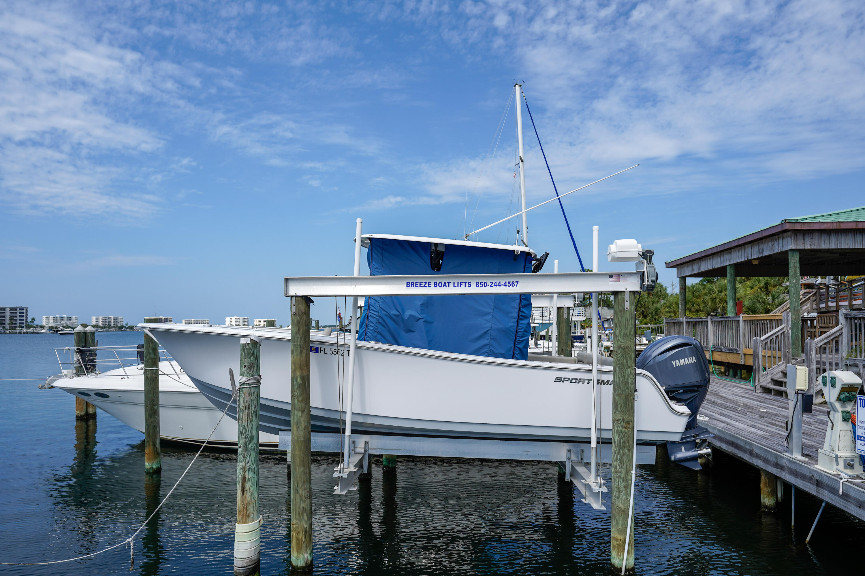 602 Harbor Boulevard, Unit 301 Destin, FL 32541 - Photo 64 of 75 a view of a chairs and table in a patio