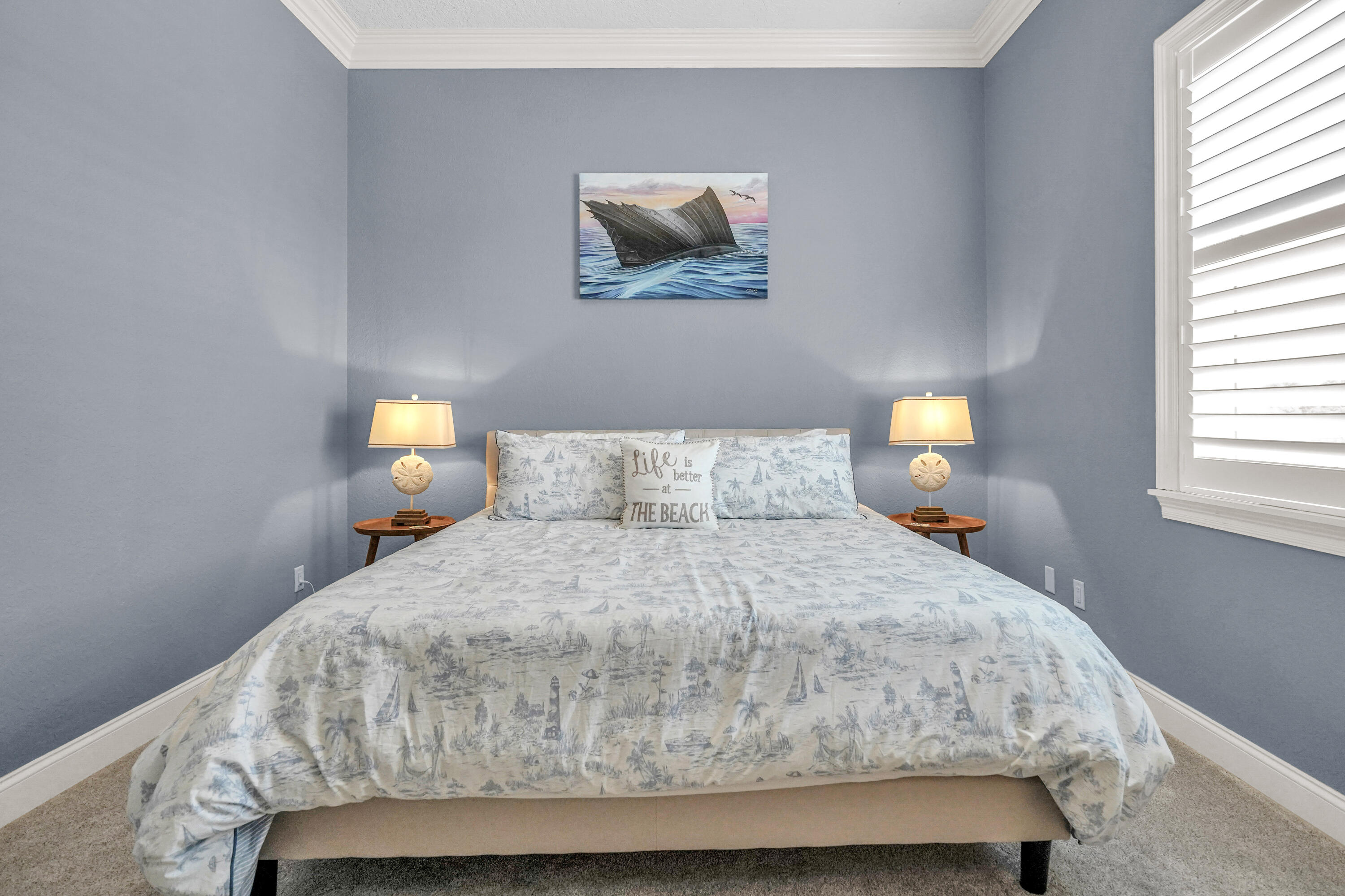 602 Harbor Boulevard, Unit 301 Destin, FL 32541 - Photo 8 of 75 a bedroom with a bed and a window