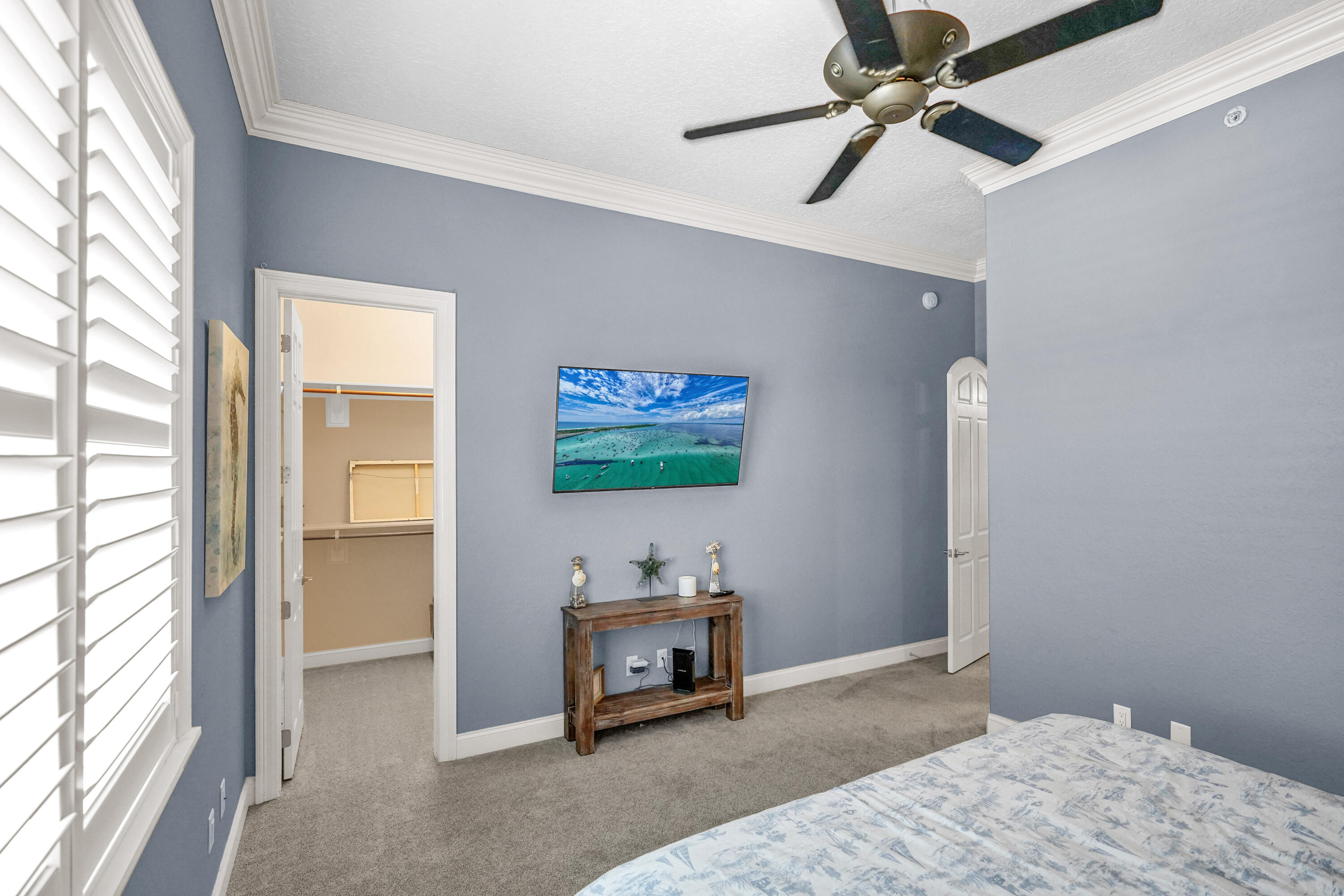 602 Harbor Boulevard, Unit 301 Destin, FL 32541 - Photo 9 of 75 a bedroom with bed and a window