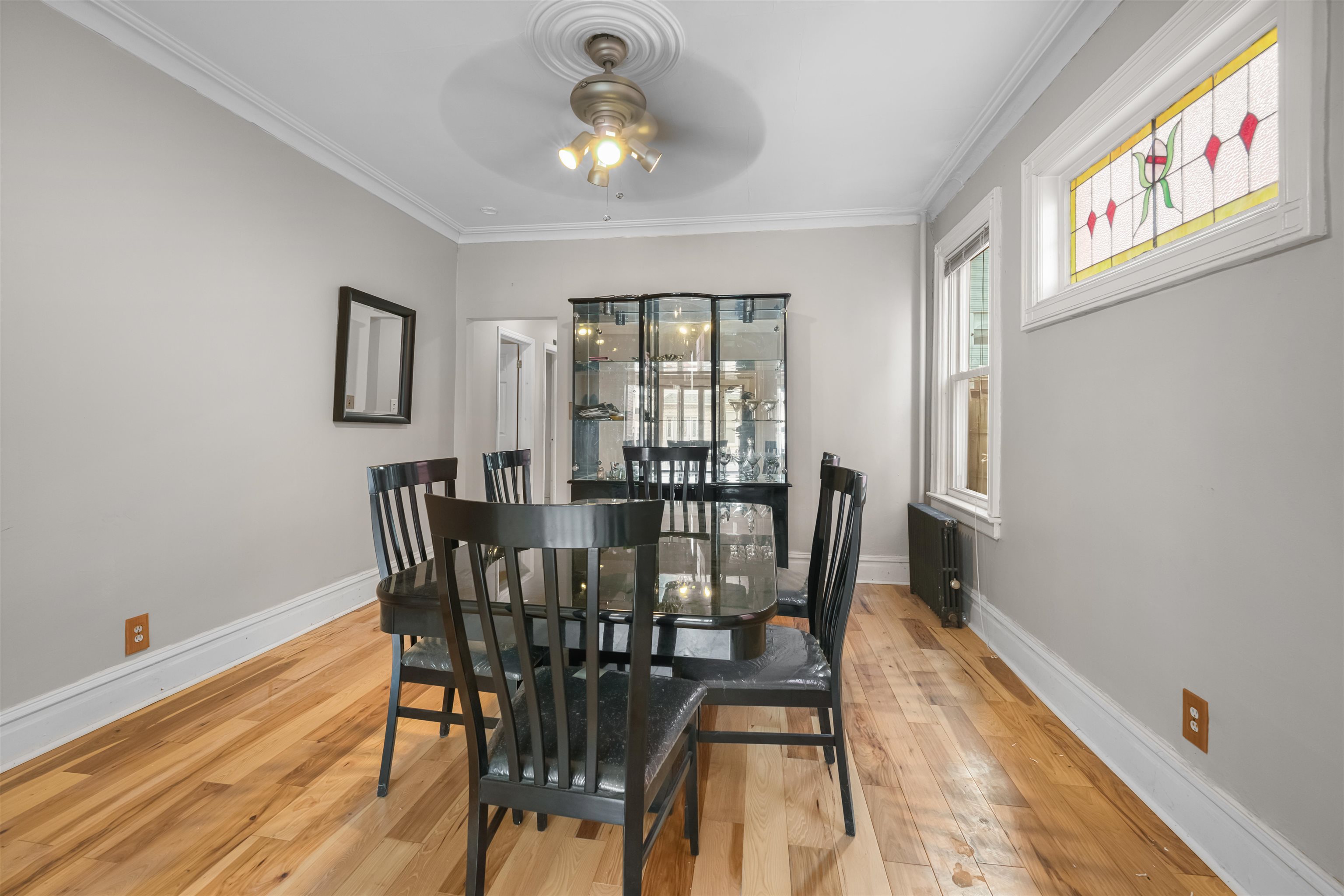 154 West 33rd Street Bayonne, NJ 07002 - Photo 40 of 40 a view of a dining room with furniture window and wooden floor